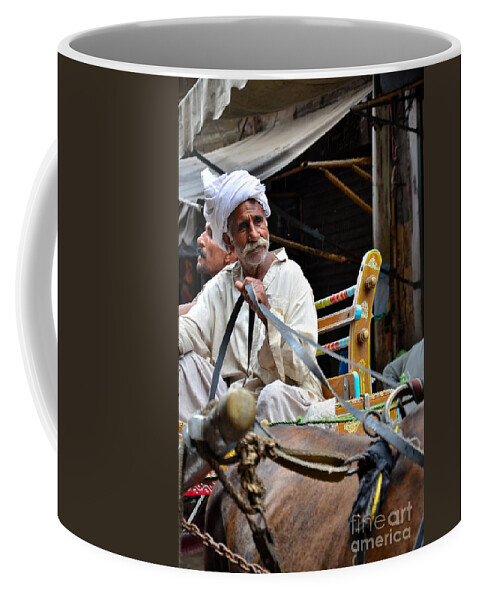 Man Coffee Mug featuring the photograph Smiling man drives horse carriage in Lahore Pakistan by Imran Ahmed