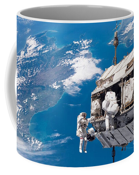Backdropped By A Colorful Earth Coffee Mug featuring the photograph STS-116 Shuttle Mission Imagery by Paul Fearn