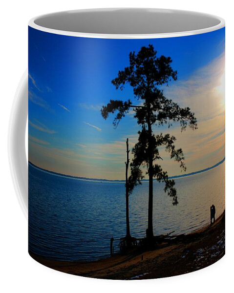 Silhouette Coffee Mug featuring the photograph The Kiss by Dan Stone