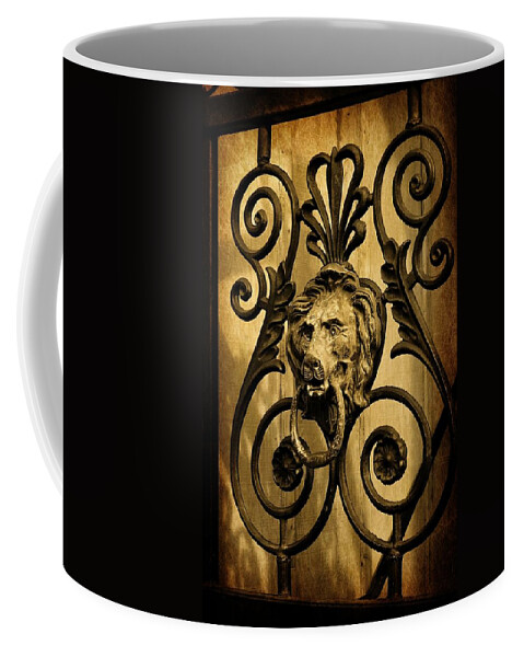 Lion Coffee Mug featuring the photograph The Lion at the Gate by Jean Goodwin Brooks