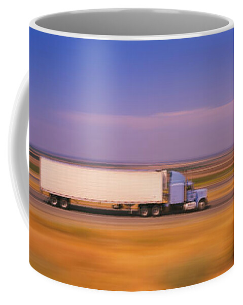 Photography Coffee Mug featuring the photograph Truck And A Car Moving On A Highway by Panoramic Images