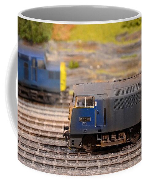 British Coffee Mug featuring the photograph Two yellow blue British Rail model railway train engines by Imran Ahmed