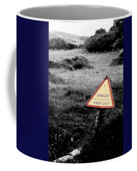 Warning Coffee Mug featuring the photograph Unexploded shells by Guy Pettingell