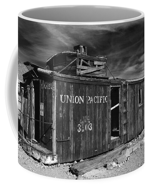 Union Pacific Coffee Mug featuring the photograph Union Pacifi Caboose at Ryholite Nevada by Greg Kluempers