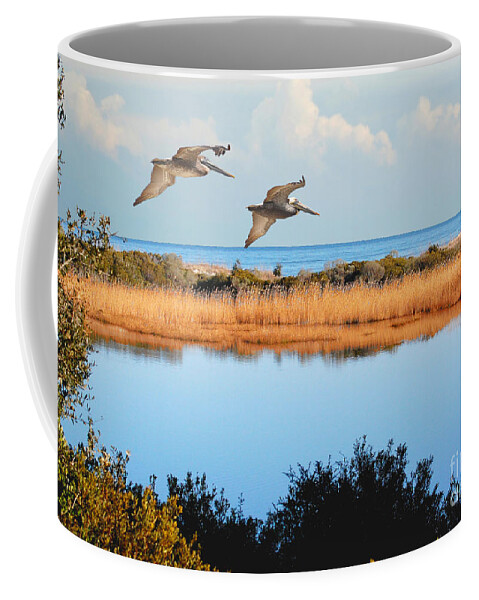 Pelicans Coffee Mug featuring the photograph Where The Marsh Meets The Atlantic by Kathy Baccari
