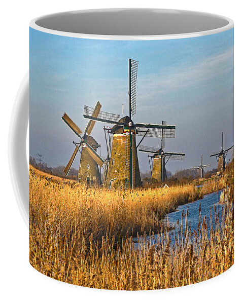 Netherlands Coffee Mug featuring the photograph Windmills And Reeds Near Kinderdijk by Frans Blok