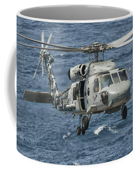 Arabian Sea Coffee Mug featuring the photograph A Us Navy Sh-60f Seahawk Flying by Giovanni Colla