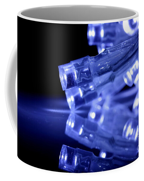 Abstract Coffee Mug featuring the photograph Blue LED lights closeup with reflection by Simon Bratt