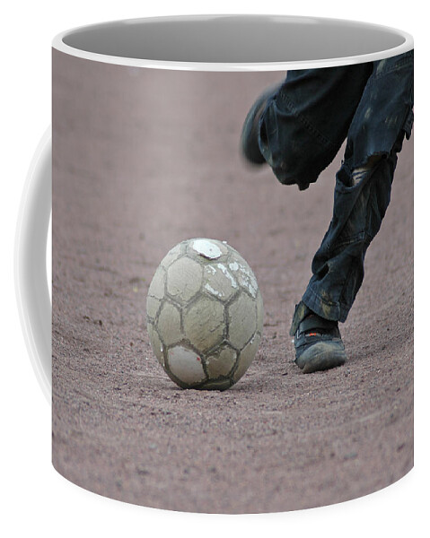 Ball Coffee Mug featuring the photograph Boy playing soccer with a ball by Matthias Hauser