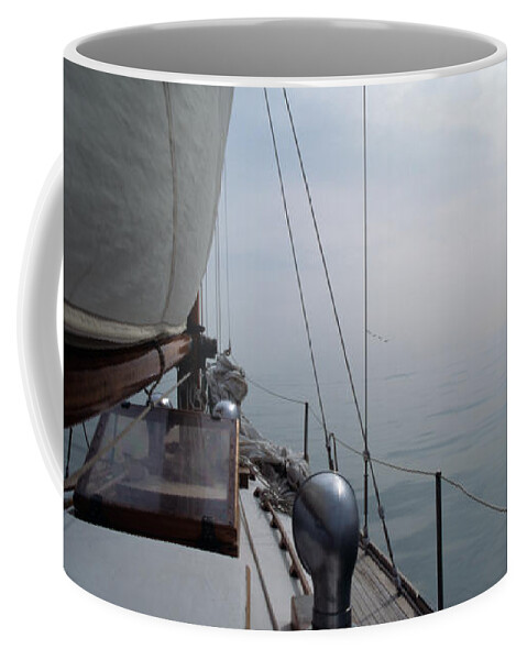 Sail Coffee Mug featuring the photograph Classic Wooden Sailboat with no Horizon off the Bow by John Harmon