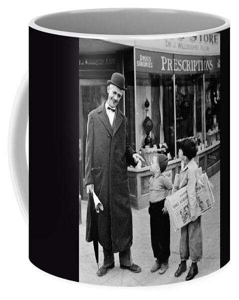 -ecq- Coffee Mug featuring the photograph Newspaper Boy, Silent Still by Granger
