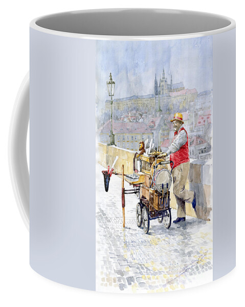 Watercolor Coffee Mug featuring the painting Prague Charles Bridge Organ Grinder-Seller Happiness by Yuriy Shevchuk