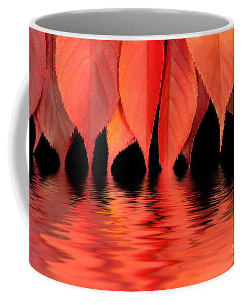 Flames Coffee Mug featuring the photograph Red autumn leaves in water by Simon Bratt