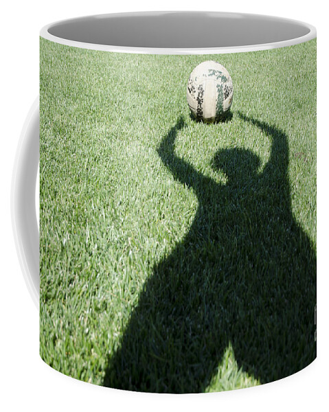 Football Coffee Mug featuring the photograph Shadow playing football by Mats Silvan