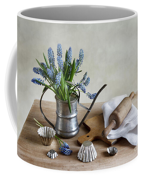 Metal Coffee Mug featuring the photograph Still Life with grape hyacinths by Nailia Schwarz