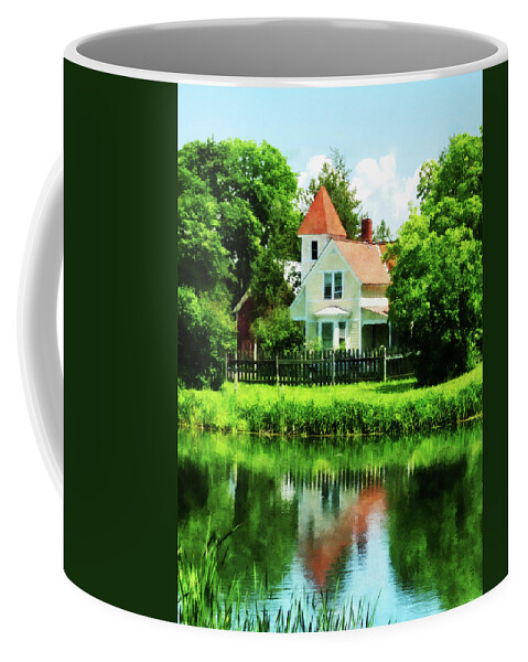 Lake Coffee Mug featuring the photograph Suburban House with Reflection by Susan Savad