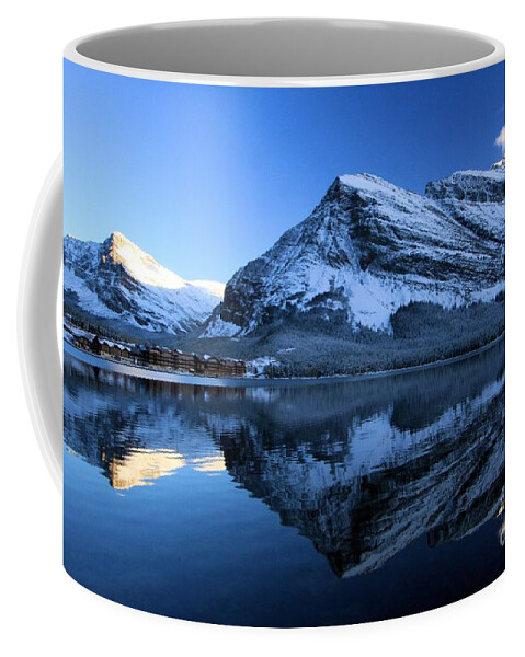Swiftcurrent Lake Coffee Mug featuring the photograph Sunset Over Many Glacier Lodge by Adam Jewell