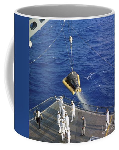 1965 Coffee Mug featuring the photograph The Gemini-3 Spacecraft Is Hoisted by Stocktrek Images