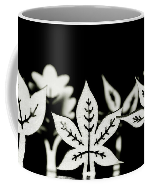 Leaf Coffee Mug featuring the photograph Wooden leaf shapes in black and white by Simon Bratt