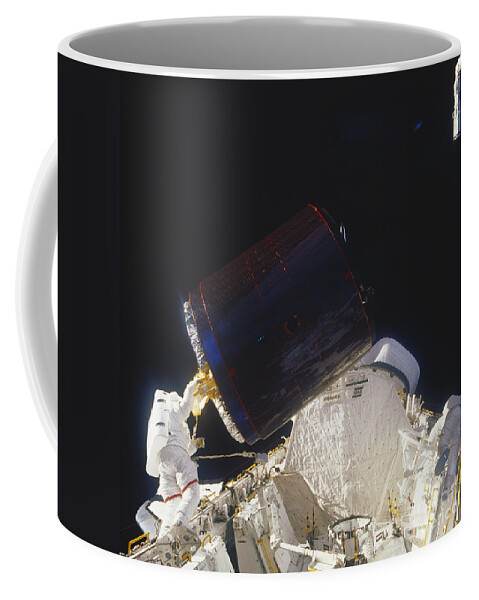 Space Travel Coffee Mug featuring the photograph Discovery Spacewalk #3 by Science Source