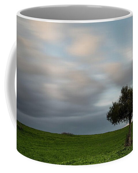Olive Tree Coffee Mug featuring the photograph Lonely Olive tree with moving clouds #1 by Michalakis Ppalis