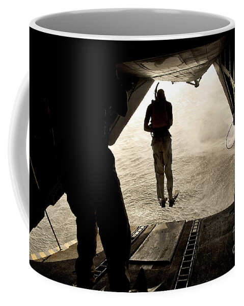 Africa Coffee Mug featuring the photograph U.s. Air Force Pararescuemen Jump #1 by Stocktrek Images