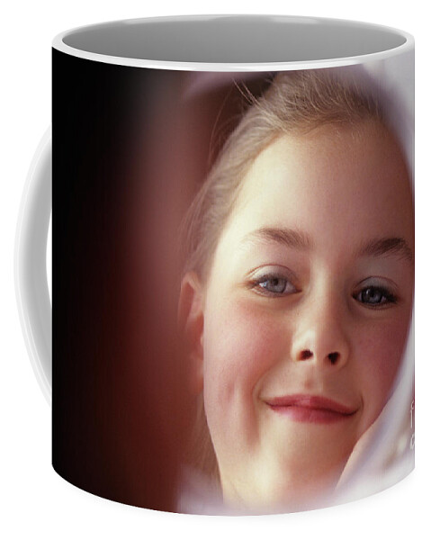 Child Coffee Mug featuring the photograph Young Girl Smiling in Mirror #1 by Jim Corwin