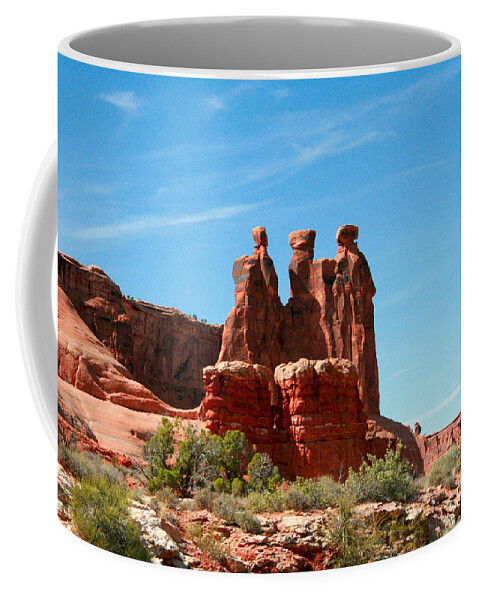 Arches National Park Coffee Mug featuring the painting 3 Gossips Hoodoos Arches National Park Moab Utah by Corey Ford
