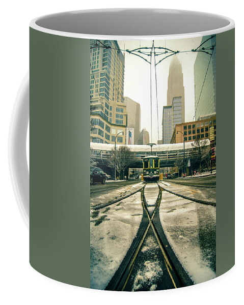 Streetcar Coffee Mug featuring the photograph Streetcar Waiting For Passengers In Snowstrom In Uptown Charlott #3 by Alex Grichenko