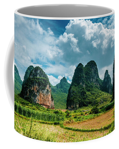 Karst Coffee Mug featuring the photograph Karst mountains and rural scenery #52 by Carl Ning
