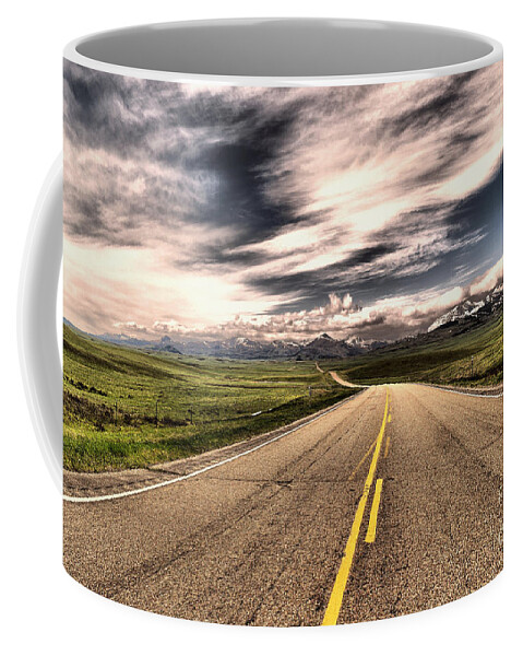 Road Coffee Mug featuring the photograph A long road to the mountains by Jeff Swan