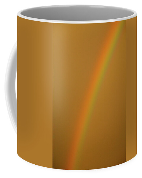 Rainbow Coffee Mug featuring the photograph A Sunset Rainbow by Diana Hatcher