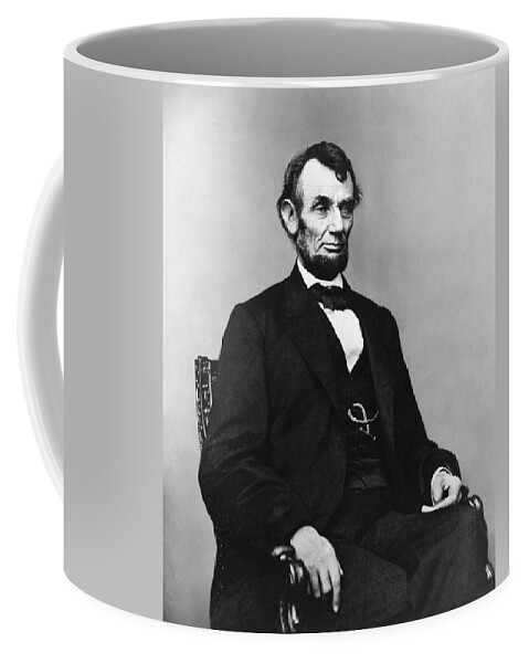 abraham Lincoln Coffee Mug featuring the photograph Abraham Lincoln portrait - used for the five dollar bill - c 1864 by International Images