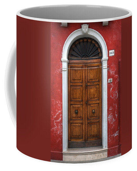 Door Coffee Mug featuring the photograph an old wooden door in Italy by Joana Kruse