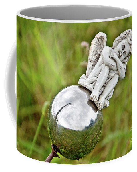 Photograph Coffee Mug featuring the photograph Angel on her Silver Ball by Adriana Zoon