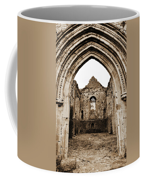 Athassel Coffee Mug featuring the photograph Athassel Priory Tipperary Ireland Medieval Ruins Decorative Arched Doorway Into Great Hall Sepia by Shawn O'Brien