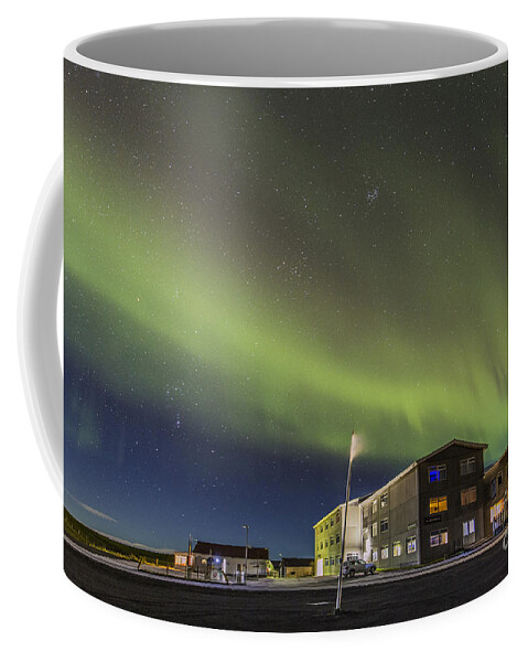 Aurora Coffee Mug featuring the photograph Aurora over hotel by Hitendra SINKAR