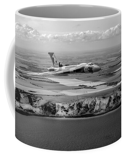 Avro Vulcan Coffee Mug featuring the photograph Avro Vulcan over the white cliffs of Dover black and white versi by Gary Eason