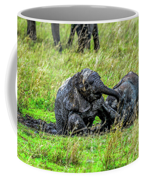 Africa Coffee Mug featuring the photograph Baby Elephants Rolling in the Mud by Marilyn Burton