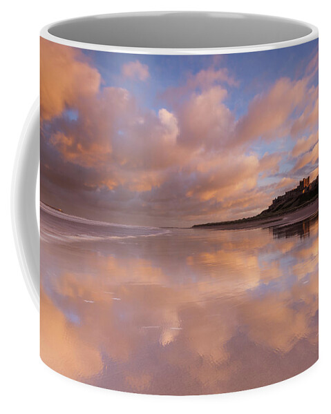 Bamburgh Castle Coffee Mug featuring the photograph Bamburgh Castle sunset reflections on the beach by Anita Nicholson