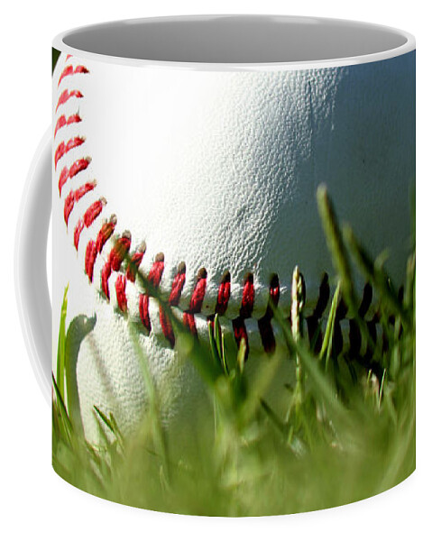 Baseball In Grass Coffee Mug featuring the photograph Baseball in Grass by Chris Brannen