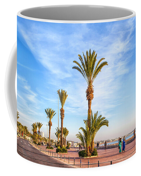 Africa Coffee Mug featuring the photograph Beach promenade of the african harbor city Agadir in Morocco by Gina Koch