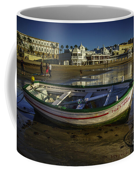 Andalucia Coffee Mug featuring the photograph Beached Boat Cadiz Spain by Pablo Avanzini