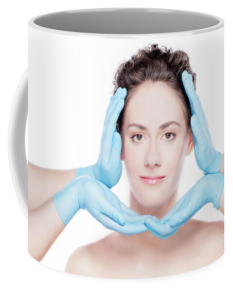 Plastic Coffee Mug featuring the photograph Beautiful woman having her face improved by plastic surgeons. by Michal Bednarek