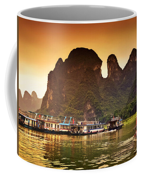 Sunset Coffee Mug featuring the photograph Boats by the river return-China Guilin scenery Lijiang River in Yangshuo by Artto Pan