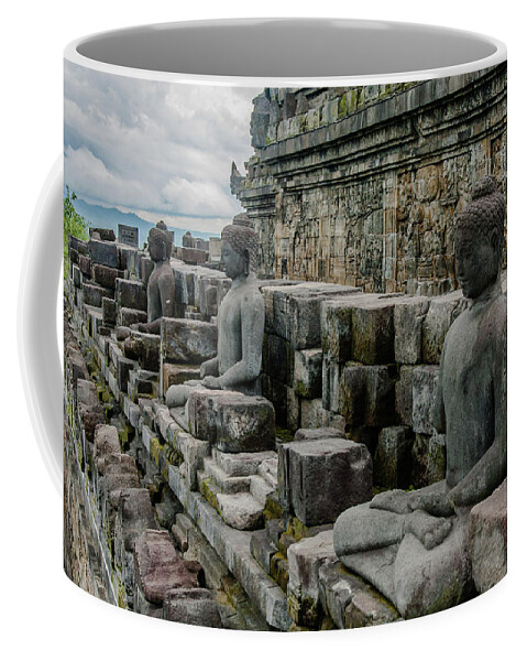 Ancient Coffee Mug featuring the photograph Buddhas of Borobudur by Volodymyr Dvornyk