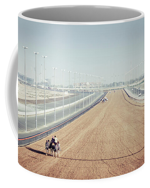 Al Marmoom Coffee Mug featuring the photograph Camel racing track in Dubai by Alexey Stiop