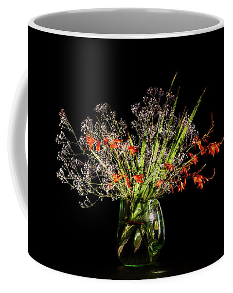 Baby's Breath Coffee Mug featuring the photograph Cascade of white and orange. by Torbjorn Swenelius