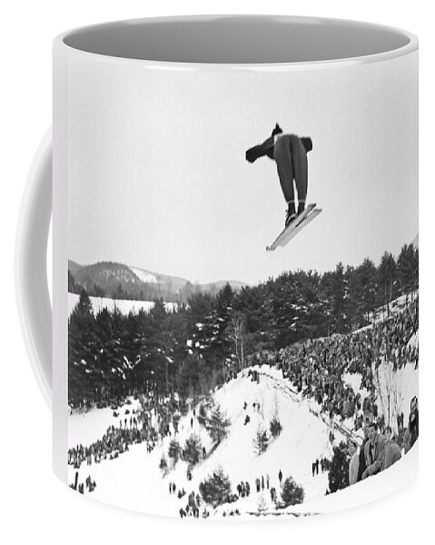 1950's Coffee Mug featuring the photograph Dartmouth Carnival Ski Jumper by Underwood Archives