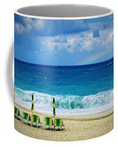 Deck Chairs Coffee Mug featuring the photograph Deck chairs and distant rainbow by Silvia Ganora